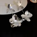 Fashionable silver-toned flower petal dangle earrings featuring a high-polished finish - 3D Mirror Finish Petal (30#) / Silver