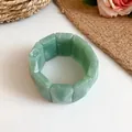 Close-up detail of a vintage green marbled acrylic stretch bracelet with rectangular beads - Green