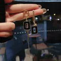 Elegant asymmetric gold earrings with black rectangular charms and long tassel detail - Square Geometric Style / 925 Silver Needle / Black