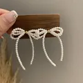 French retro pearl bow stud earrings with elegant dangling tassels in warm white - Woven Pearl Style (2#)