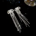 Elegant sparkly rhinestone bow tassel earrings in silver finish for a luxurious look - Long Pave Tassel Style (6#)