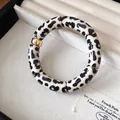Close-up detail of vintage acrylic leopard print spliced bracelet in a soft jewelry box - 54#