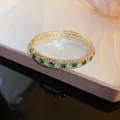 Elegant vintage style gold-tone cuff bracelet with green and white cubic zirconia stones. - Square Open Cuff Bracelet / Silver Green