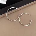 Minimalist high-shine silver twisted hoop earrings for a modern and stylish look - 4.5CM / Silver
