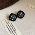 Close-up of retro black velvet square stud earrings with white polka dot fabric detail - Rhombus Polka Dot Style / Black