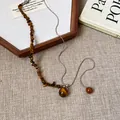 Tiger eye stone pendant necklace with silver chain in retro Maillard style detail view - 5# Necklace-Silver-Brown