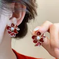 Elegant red flower and butterfly stud earrings with central pearl for Lunar New Year. - Petal Butterfly Style (11#) / Rose Gold Red