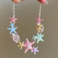 Detailed view of colorful starfish and shell charms on a silver chain necklace - Macaron Enameled Starfish Shell Clavicle Chain / 13# Necklace-Silver-Multicolor
