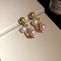 Detailed view of elegant gold flower earrings with white and pink pearls - Silver Earring Post (19# Earring) / Gold-White-Pink