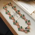Elegant vintage gold-tone necklace featuring pink stones and green leaf accents for women - Necklace (Gemstone Lace Style) / Gold-Pink-Green