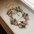 Exquisite vintage pink cat-eye stone bracelet with green leaves and rhinestones. - Bracelet (Gemstone Lace Style) / Gold-Pink-Green