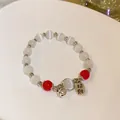 Elegantes handgemachtes Perlenarmband mit weißen Katzenaugen und Glücksbringer - 63# Armband-silber-glücksglocke