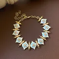 Vintage gold plated enamel bracelet with blue floral patterns and light brown crystals. - White Enamel Rhombus Bracelet (17#) / Gold-Blue