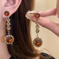 Vintage-style amber rhinestone drop earrings with ornate floral design - Amber Sunflower Long Drop Earrings (Silver Earring Post) / Gold Brown