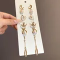 Vista dettagliata del set di orecchini vintage con perle e strass di lusso su cartoncino - 9# Perno in argento - Oro