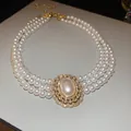Elegant triple-strand pearl necklace with vintage gold-plated zircon pendant - Necklace / 5mm / Gold