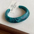 Emerald green marbled resin open cuff bracelet featuring stylish textured carvings - Style 35