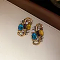 Vintage style gold-tone earrings featuring colorful gemstones and clear rhinestones - Earrings (44# Silver Earring Post) / Gold-Blue-Yellow