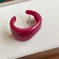 Fuchsia pink chunky resin cuff bracelet with an irregular geometric open design - Style 56