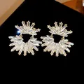 Close-up of crystal wheat ear stud earrings with gold finish on black background - Gold with Clear Rhinestone