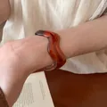 Elegant irregular wide acrylic bangle featuring a unique amber marbled pattern for women - Wave Style (59#)