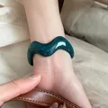 Minimalist teal acrylic wide bangle with irregular wave design and marbled finish - Wave Style (62#)