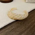 Elegant cream marbled acrylic twisted open cuff bangle with a smooth glossy finish - Twist Style (68#)