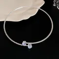 Detail view of a minimalist silver choker necklace featuring two zircon heart charms. - Blue Heart Pendant Style (Style 2)