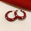 Detail view of retro red polka dot hoop earrings featuring high-gloss drip oil finish - Moon Shape (3# Silver Post) / Burgundy