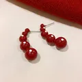 Close-up of red polka dot bead earrings with vintage drop design and durable steel needles. - Beaded Style (6# Silver Post) / Burgundy