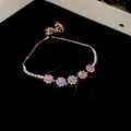 Elegante bracciale a fiori in oro rosa con zirconi scintillanti su fondo nero di lusso - Fiore a Cinque Petali 23# (HB285-2)