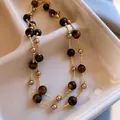 Elegante collana Maillard con pietre occhio di tigre marroni e dettagli dorati - Stile 18 / Marrone oro