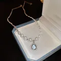 Elegant silver bead and pearl necklace featuring a stunning blue teardrop pendant - Blue Water Drop Pendant Style (HN2148) / Silver
