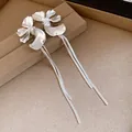 Detailed close-up of elegant silver flower drop earrings with long snake chain tassels - Flower Tassel (HE29294) / Silver