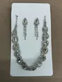 Elegant silver-toned bridal jewelry set with clear rhinestone necklace and teardrop earrings - Silver