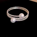 Detailed view of silver three-layer open bracelet with rhinestones and faux pearls - Three-Layer Open Style (3) / Silver