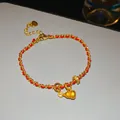 Elegante bracciale a corda rossa con charm serpente in zircone dorato per l'anno della vipera. - Stile Avvolto Zucca Cuore / Oro e Rosso