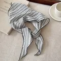 Close-up detail of black and white striped ribbon scarf with delicate stitched edges - Black White Stripe Polka Dot White