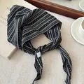 Detailed macro view of a black and white striped fabric headband with elegant dotted patterns. - Black White Stripe Polka Dot Black