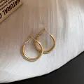 Classic minimalist golden round hoop earrings with a shiny polished finish for women - Simple Smooth Hoop (98) / 25mm / Gold