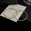Elegante silberne gedrehte Creolen für Damen, stilvolles minimalistisches Design. - 64# Silberner Ohrstecker - Silber