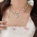 Close-up of sweet dopamine style pendant necklace featuring pearls and heart charm - Pink Pentagram Heart