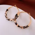 Vintage retro leopard print fabric wrapped gold hoop earrings for elegant fashion styling - Metal Rimmed Leopard Earrings / Brown