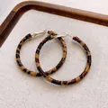 Stylish retro leopard print fabric wrapped large hoop earrings shown on beige tray - Fabric Leopard Large Hoop / 5cm / Brown