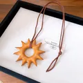 Vintage sun-shaped wooden pendant necklace with adjustable brown cord for women. - 72# Necklace - Brown - Sun