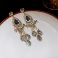 Elegant long grey crystal tassel earrings with silver needle on a porcelain plate. - Style 59#