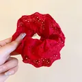 Close-up of a red hollow-out lace pleated scrunchie showing delicate floral embroidery detail - Floral Hollow Out Lace Scrunchie / Red