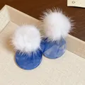 Detailed macro view of winter pom-pom earrings with blue marble resin circular discs - Round Plush Ball Resin Style (HE29688) / White And Blue