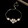 Detailed macro shot of vintage flower bracelet with sparkling zircons and adjustable gold chain - Flower Pendant Style / Silver