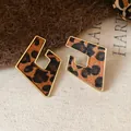 Chic leopard print geometric earrings featuring a gold frame and pony hair texture - Irregular Rhombus Hollow